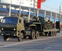 A Russian Army KamAZ military tank transporter carrying an SU-85M