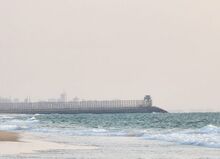 Zikim beach with maritime barrier.jpg